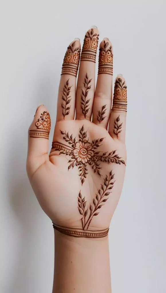 Elegant front-hand mehndi with geometric shapes and fine line detailing